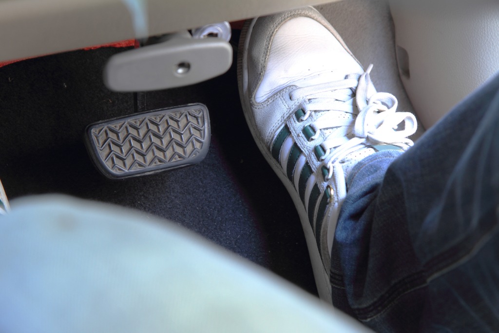 foot pressing on accelerator pedal