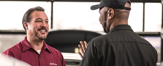 Jiffy Lube employees talking to each other